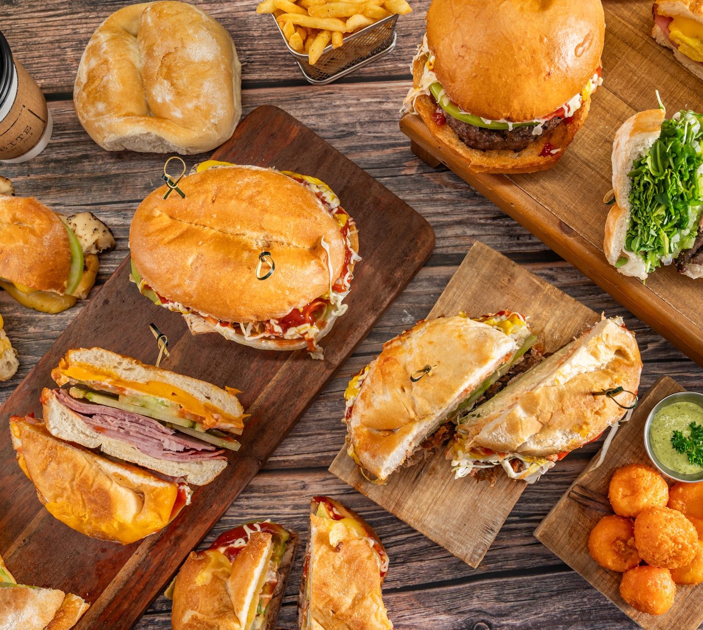 Signature sandwiches and sides spread at BITE Sandwich Miami